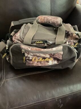 Cabela's Camo and Olive Green Duffel Bag with Yellow Logo